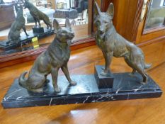 L CARVIN - Pair of Spelter German Shepherd Dogs on Large marble plinth. One Shepherd on Marble step.