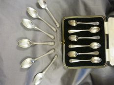 A boxed set of six spoons Sheffield by Cooper Brothers & Sons Ltd and a set of six silver engraved