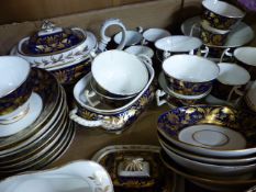 Blue and Gilt china tea service with printed red marks to base in the form of a crown with cross