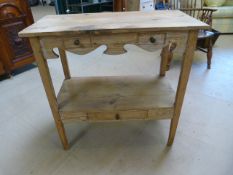 Antique pine washstand with shelving under and single drawer.