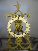Brass Single fusee movement Skeleton clock. The 16cm dial having Roman Numeral chapters below sat on