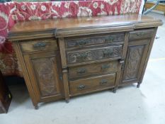 Mahogany Breakfront sideboard with Art nouveau decorated drawers flanked by two drawers