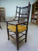 Oak Wingback 'Wool winder' armchair with Turned wooden supports and turned wooden slats leading to a