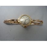 Lady's 15 Jewel 9ct gold Art Deco watch engraved with the letter "E" and dated 19th Feb 1926 to