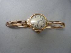 Lady's 15 Jewel 9ct gold Art Deco watch engraved with the letter "E" and dated 19th Feb 1926 to