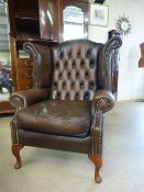 Burgundy leather button back fire side armchair