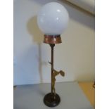 Art Deco Brass tall lamp with white glass globe with classic nude figure