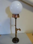 Art Deco Brass tall lamp with white glass globe with classic nude figure