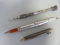 Three propelling pencils. One silver hallmarked Sampson Morden & Co 1927, the other a Victorian