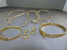 Two Rolled Gold bangles with a pair of earrings and vintage glasses A/F