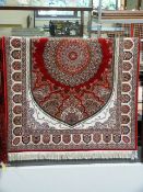 Red ground handwoven silk rug with medallion design 175cm x 118cm