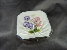 Hallmarked silver compact with cream Guilloche floral decorated enamel to front.