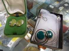 Pair of contemporary earrings set with blue and green stone and a Silver clip on earrings with