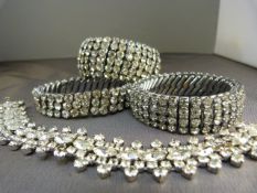 Three Diamante expanding bangles - some missing stones - stones in bags