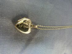 Hallmarked 9ct Gold locket on chain with floral design