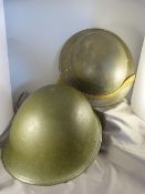 Mark 2 British war time Brodie helmet and a mark 4 British 'Turtle' helmet