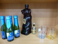 Cossack (empty) bottle in the form of a Russian Bear, Four bottles of Babycham and three glasses