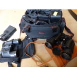 Pair of Nipole binoculars, Bushnell binoculars, Blackfoot binoculars and a Nikon F301 camera in case