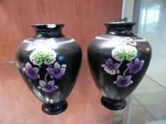 Pair of small Shelley vases decorated with flowers on a black background approx 11 cm high