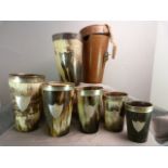 A set of six graduated horn and hallmarked silver hunting beakers in original fitted leather case