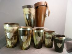 A set of six graduated horn and hallmarked silver hunting beakers in original fitted leather case