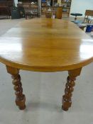 Large extending mahogany table on Barley Twist legs with castors - Handle in office
