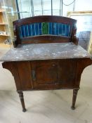 Stained pine washstand with marble top and blue tiled back