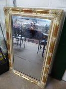 Plaster framed wall mirror with pine wooden back