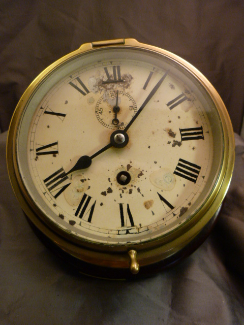 C.1950's/60's Nautical Ship's Bulkhead brass clock. Enamelled face with Roman Numerals, appears to