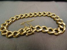 18ct Gold Curb Link Bracelet, approx 10mm Wide and Approx 9" long with a safety clasp and safety