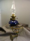 Bristol blue oil lamp with brass wall bracket