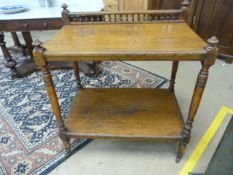 Oak two tier dumbwaiter on castors with gallery back