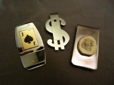 A Stainless steel money clip by Baraka with 18ct Gold hallmarked panel in the Form of a Jack Card.