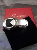 A Boxed stainless steel Cartier Money clip in the form of a Compass.