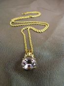 QVC 9ct Gold set Oval pale Lilac stone measuring approx 12mm x 10.12 mm. Hung from a 20" 'rope' link
