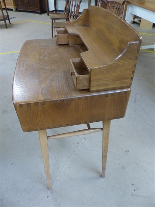 Ercol 'Windsor' light elm desk with single drawer and two raised drawers above on tapering splayed