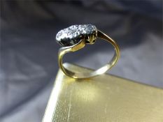 Vintage 9ct Gold 3 stone Diamond (illusion set) Crossover ring. Centre Stone approx 0.05pts with