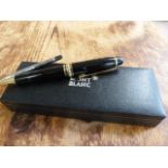 A Boxed Mont Blanc Meisterstuck Biro pen with White star end. Yellow and Black metal mounted pen