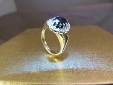 18ct Gold sapphire and Diamond ring set with large centre sapphire. UK - J Total Weight - 4.7g