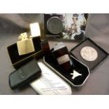 Tinned Davidoff lighter, Boxed Zippo lighter and two commemorative coins