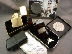 Tinned Davidoff lighter, Boxed Zippo lighter and two commemorative coins