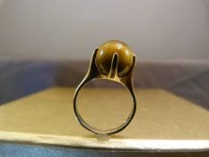 9ct Gold 'worry' Ring by V&FP, contemporary design from 1967. An approx 10.2mm Tigers Eye Ball