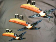 Three reproduction graduated flying Guiness Toucan wall plaques