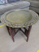 Indian coloured brass circular table with Peacock design on hardwood fold out stand