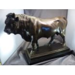 AFTER BARYE - Bronze figure of a standing Bull, signature to base. Length - 48.5cm, Height - 33cm.