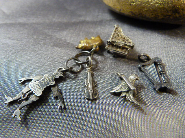 Collection of small charms - Piano with lift filigree top, Harp, bird on swing, others and an