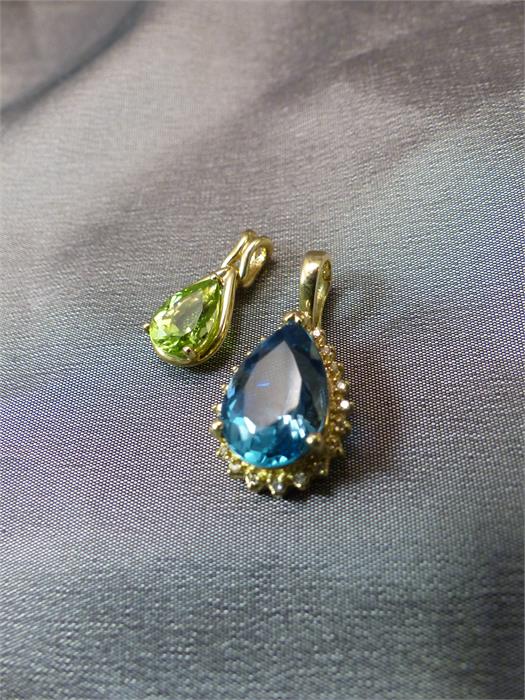 Two 9ct Tear Drop pendants - 1 set with an approx 10.25mm x 7.4mm wide Peridot. The other set with