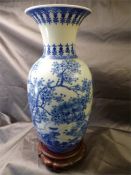 Blue and White Chinese Vase depicting Flowers and Trees on rosewood stand A/F. Six figure blue