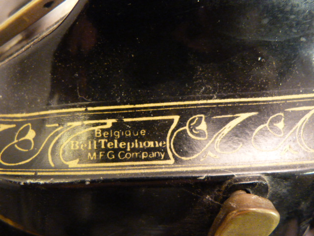 A Black painted and Gilt brass mounted telephone, marked 'Belgique Bell Telephone M.F.G company' - Image 3 of 4