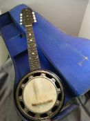 An unmarked banjo mandolin with mother of pearl inlay to fretboard and head. 6 strings missing needs